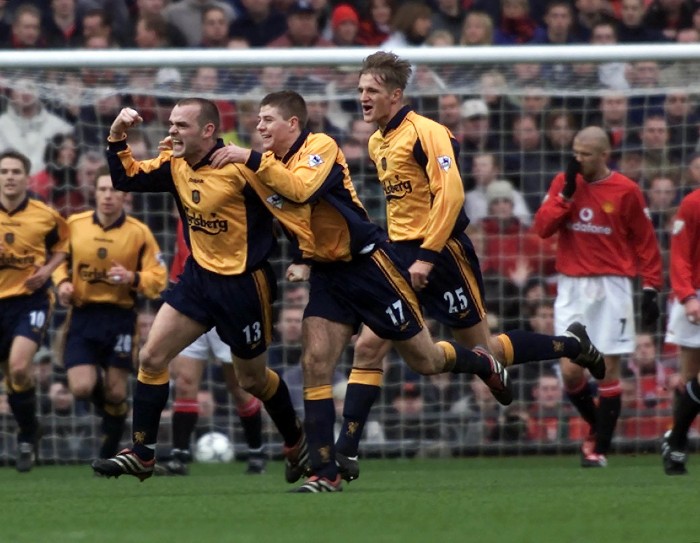 THIS PICTURE CAN ONLY BE USED WITHIN THE CONTEXT OF AN EDITORIAL FEATURE. NO WEBSITE/INTERNET USE UNLESS SITE IS REGISTERED WITH FOOTBALL ASSOCIATION PREMIER LEAGUE. Liverpool's Danny Murphy (Number 13) celebrates with his team-mates after giving his side the lead against Manchester United, during their FA Premiership football match at United's Old Trafford ground in Manchester.